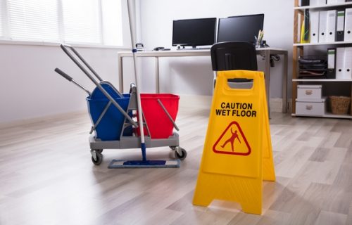 Wet Floor Caution Sign On Floor Wet Floor Caution Sign And Cleaning Equipments On Floor